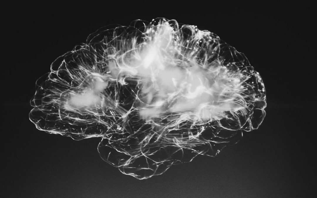Black and white photo of light organized in the shape of a brain to depict the wandering mind